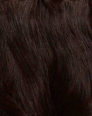 A close-up of dark brown hair extensions, showcasing their rich color and smooth texture.