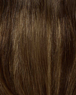 A close-up of a hair swatch of a hazelnut balayage color of hair extensions.