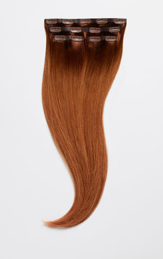 20" length Crimson Honey hair clip extensions with a white background.