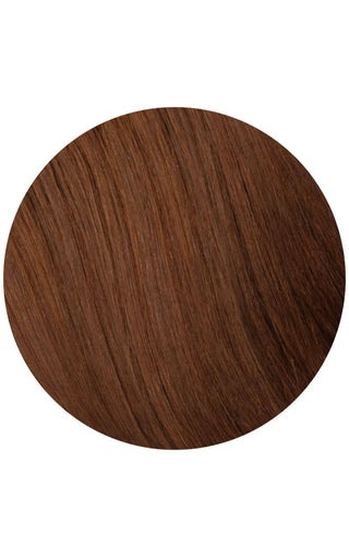 Close-up of rich brown hair color with natural highlights, showcasing depth and dimension.