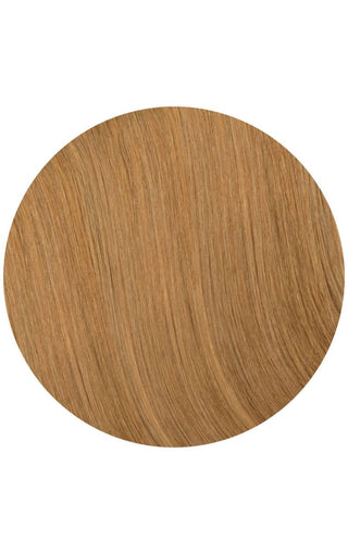 A close-up of a copper colored hair extension against a white background.