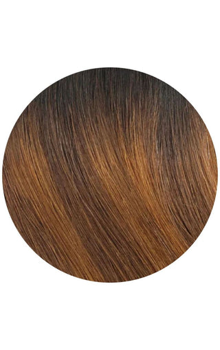 Brown and black ombre hair color, blending from dark roots to light ends, creating a natural and stylish look.