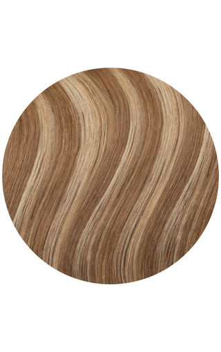 A close-up of a circle of wavy Toffee Swirl hair extension on a white background