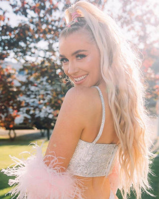 A beautiful Lady in Park with Beach Blonde Glam Seamless Pony tail Hair extension 